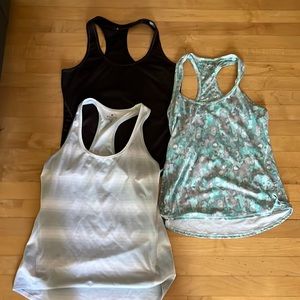 Three Athletica Workout Tops 2 Medium 1 Small All Three for $15